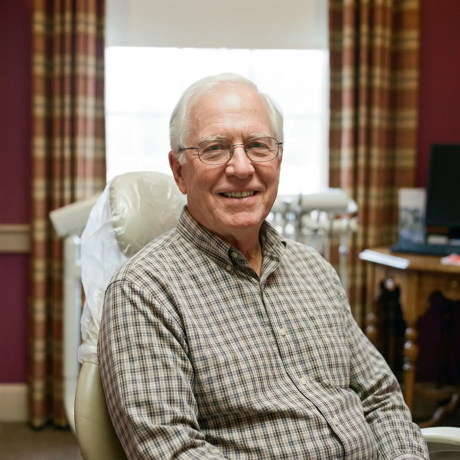 A smiling patient in a treatment room at Southern York Smile Care
