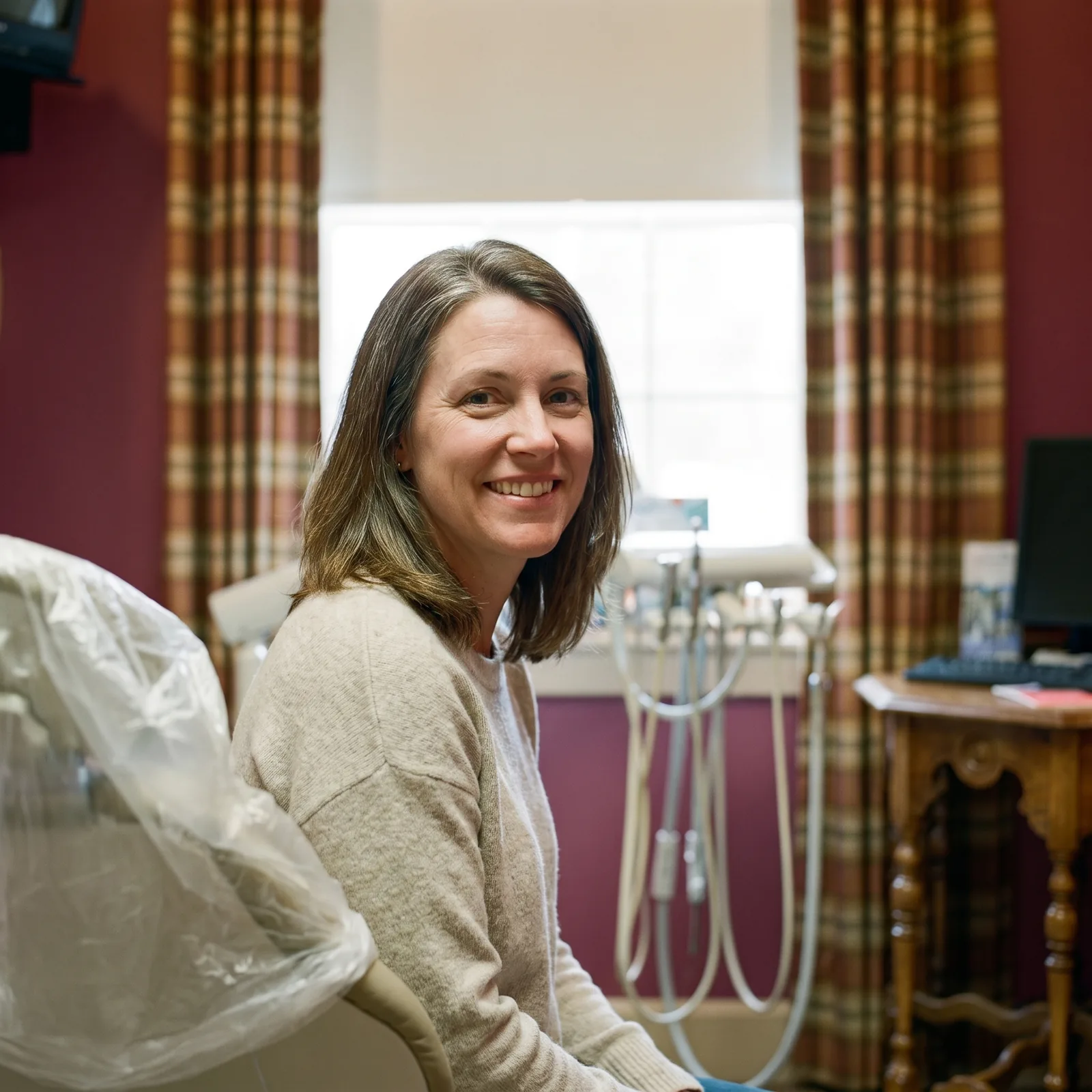 A smiling patient in a treatment room at Southern York Smile Care