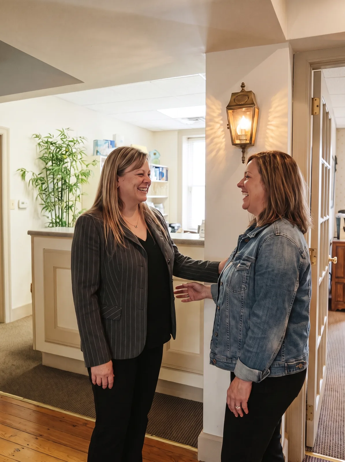 Kelley Fisher welcoming a patient at the front desk